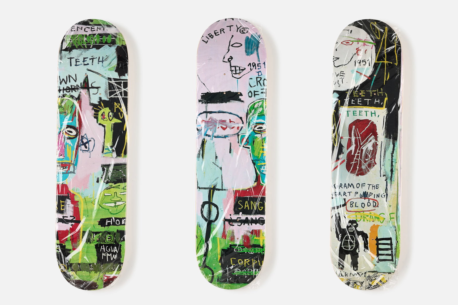 Jean-Michel Basquiat X The Skateroom, 'In Italian' Skate Decks (3): JEAN-MICHEL BASQUIAT X THE SKATEROOM Set of three 'In Italian' skate decks, 2022 Offset lithographs in colors on skate decks. Produced by The Skateroom, Belgium. Printed signature and