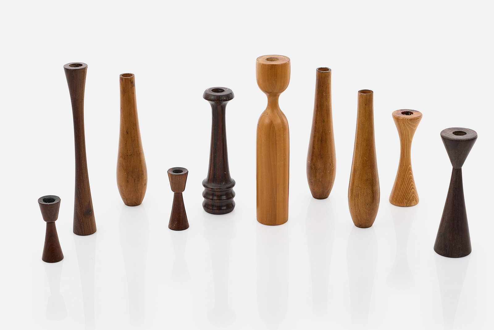 Brazilian, Candlesticks (10): BRAZILIAN Set of 10 candlesticks, 1960s Brazilian hardwoods. Tallest: 12" H x 1.75" Diameter Shortest: 4.25" H x 1.5" Diameter 