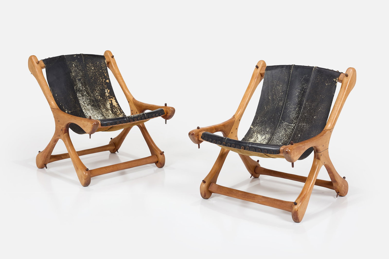 Don Shoemaker, Sling Chairs (2): DON SHOEMAKER Pair of sling chairs, 1970s Cocobolo, leather. Manufactured by Senal, Mexico. Each: 27.5" H x 23.5" W x 27.5" D Seat height: 15" 