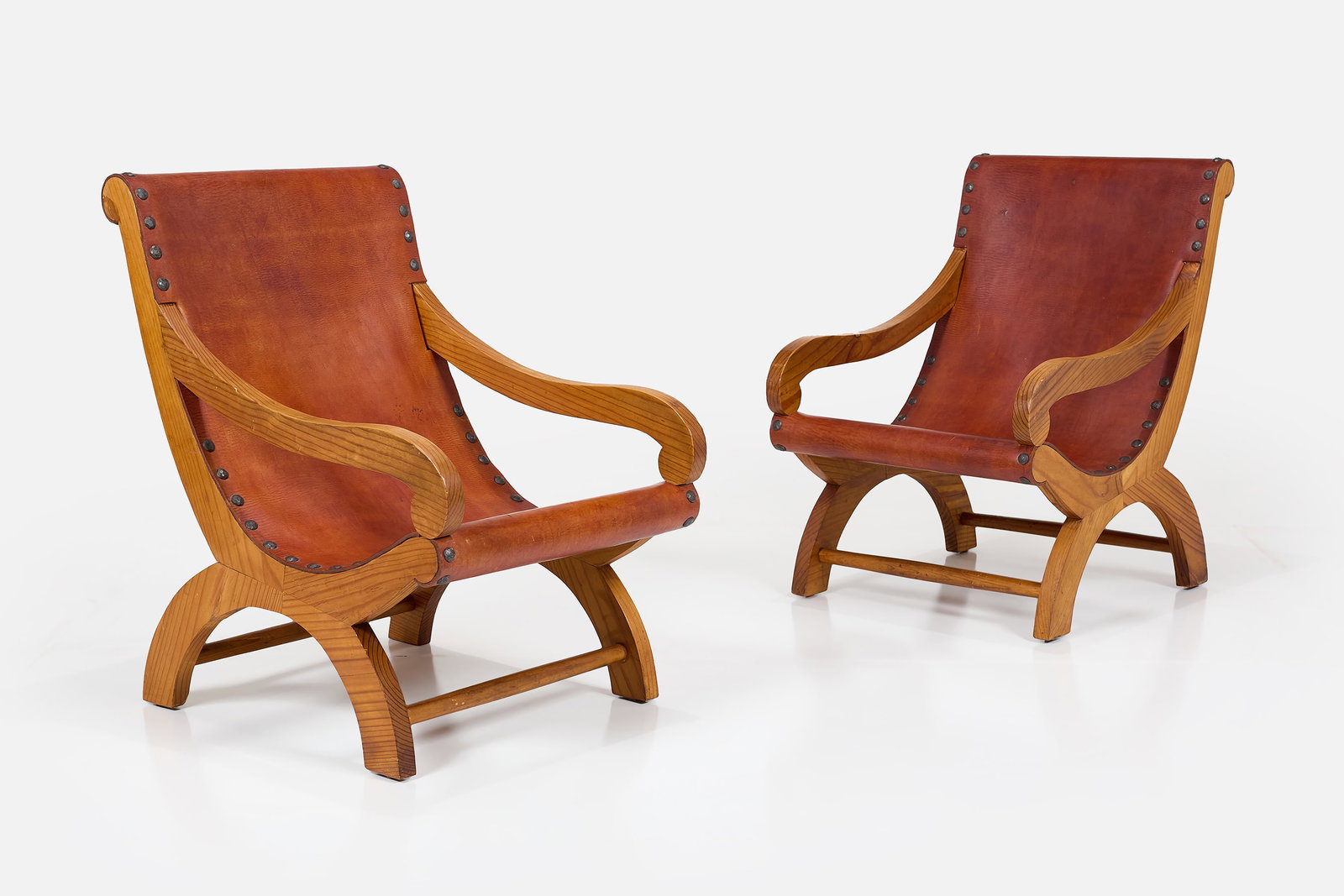 Clara Porset Style, Butaque Chairs (2): CLARA PORSET STYLE Pair of butaque chairs Leather, pine, iron. Each: 34.5" H x 23.5" W x 31" D Seat height: 15" 