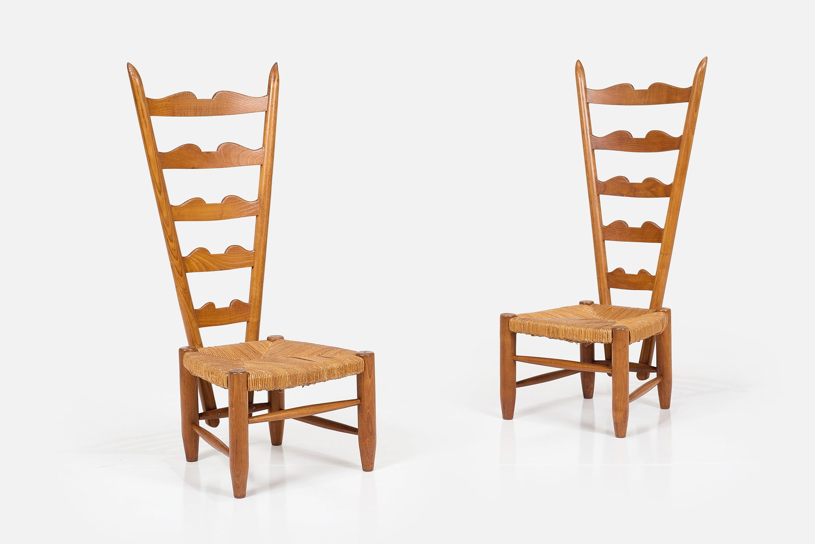 Gio Ponti, 'Fireside' Chairs (2): GIO PONTI Pair of low 'Fireside' chairs, ca. 1939 Oak, rush. Manufactured by Casa & Giardino, Italy. Each: 40" H x 16.5" W x 17.5" D Seat height: 11.25" &