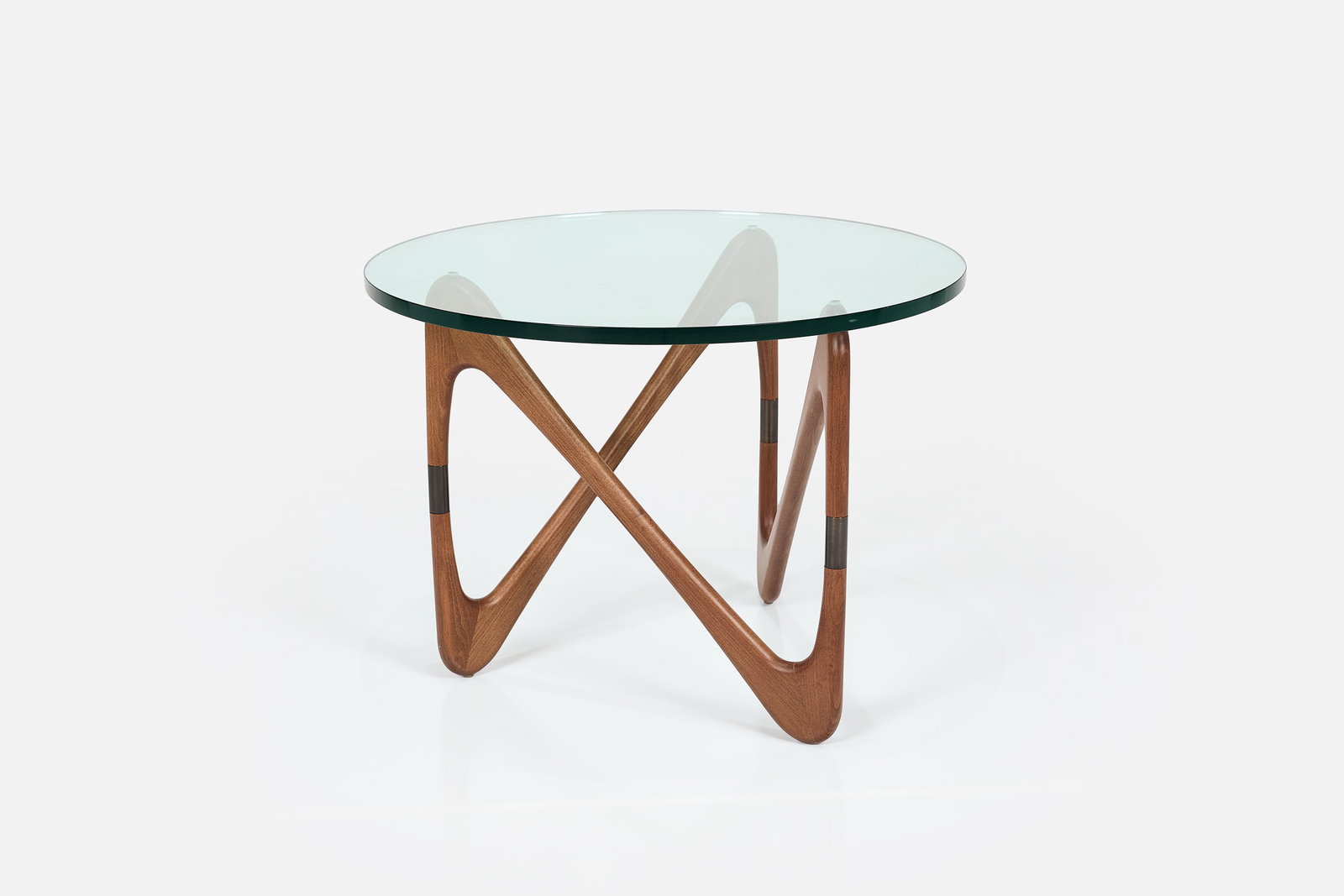 Cesare Lacca, 'Moebius' Coffee Table: CESARE LACCA 'Moebius' coffee table, 21st century Glass, mahogany, patinated metal. Manufactured by Design Within Reach, USA. 20.5" H x 28" Diameter 