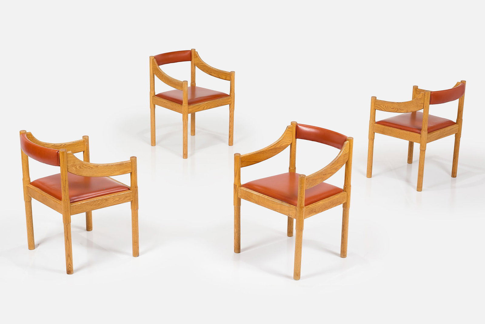 Vico Magistretti, 'Carimate' Chairs (4): VICO MAGISTRETTI Set of four 'Carimate' armchairs, ca. 1960 Beech, leather. Manufactured by Cassina, Italy. Each: 29.5" H × 23" W × 20.25" D