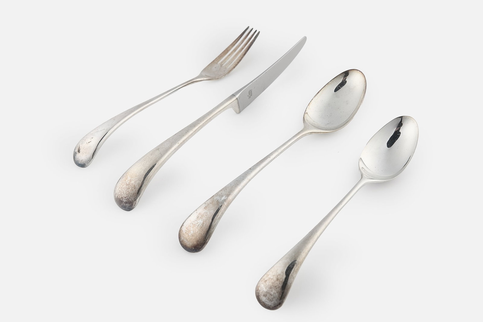 Vivianna Torun Bulow-Hube, 'Torun' Flatware (44): VIVIANNA TORUN BULOW-HUBE Four-piece 'Torun' place settings for ten, designed 1987 Silverplate, stainless steel. Manufactured by Dansk Designs, USA. Each with impressed marks "Dansk International