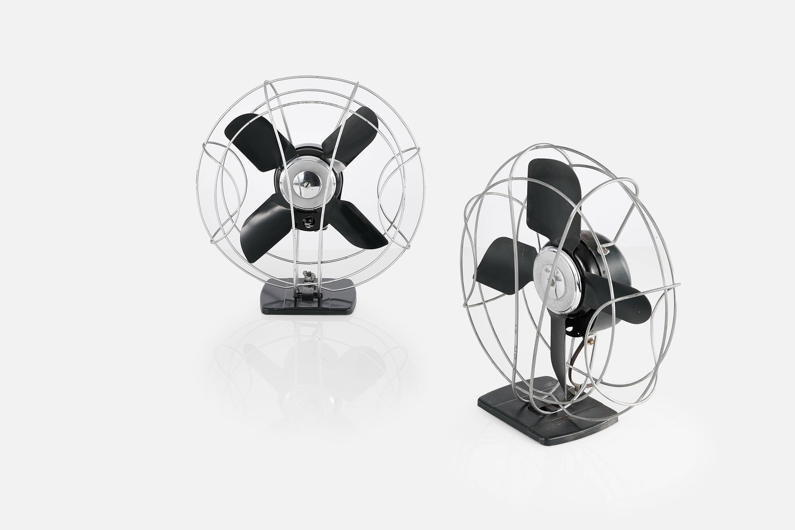 H. W. Chapman, 'Aeriet' Table Fans (2): H. W. CHAPMAN Pair of 'Airiet' table fans, 1936 Steel. Produced by Air Devices Corp., South Bend, IN. Each: 18" H x 16" W x 7" D