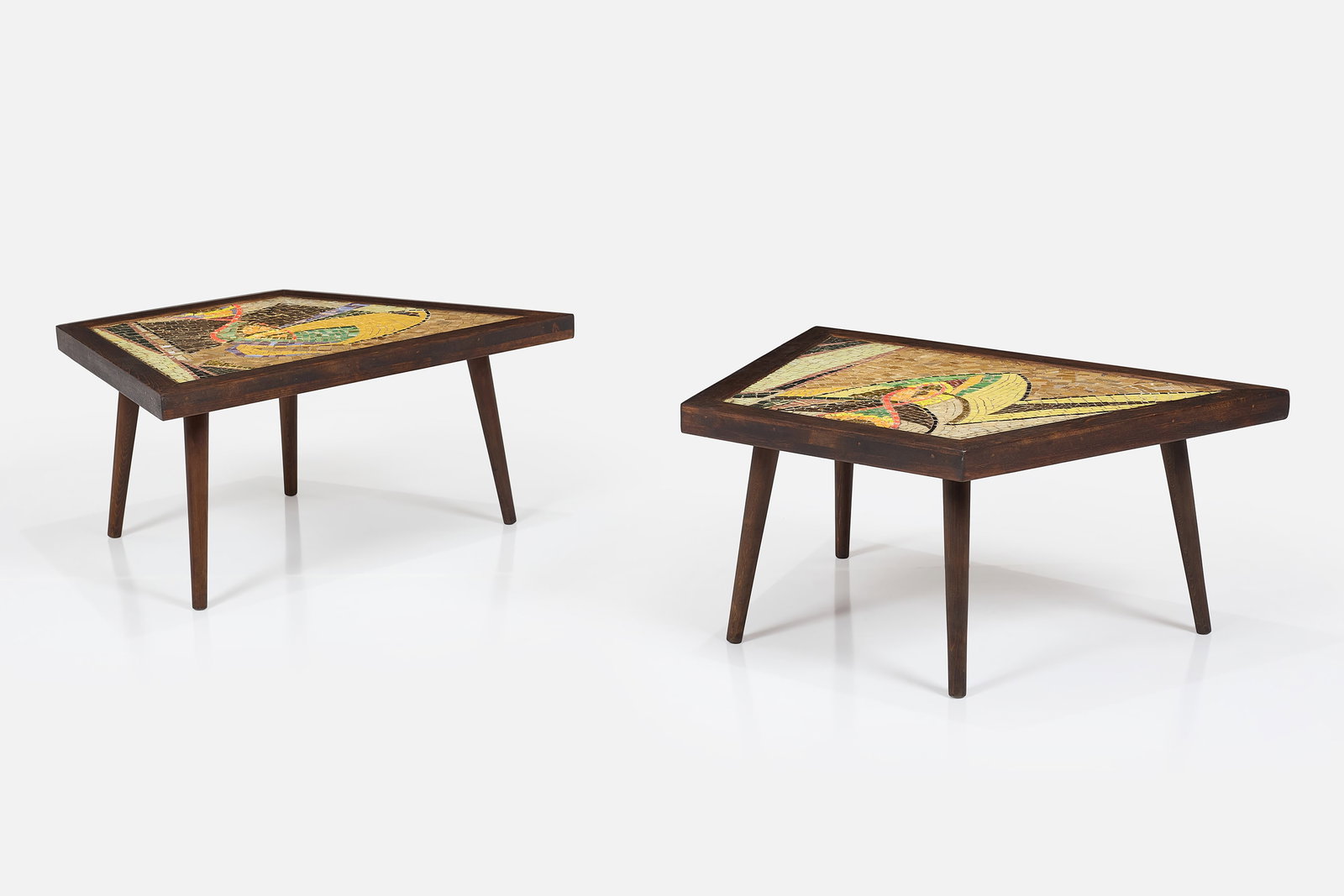 Carol Bernard, End Tables (2): CAROL BERNARD Pair of end tables, 1950s Stained oak, ceramic tile, glass tile. Each: 15.5" H x 35.25" W x 24" D 