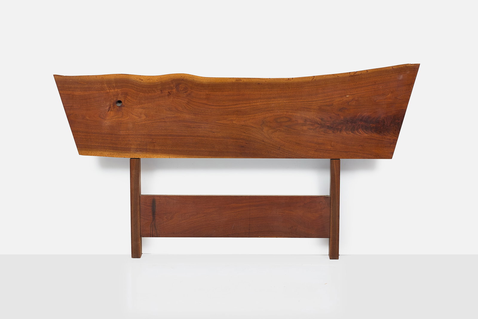 George Nakashima, Free-Edge Twin Headboard: GEORGE NAKASHIMA 'Plank' headboard American black walnut. Produced by Nakashima Studios, USA. Signed with client's name "CASH". 36.5" H x 67" W x 3" D
