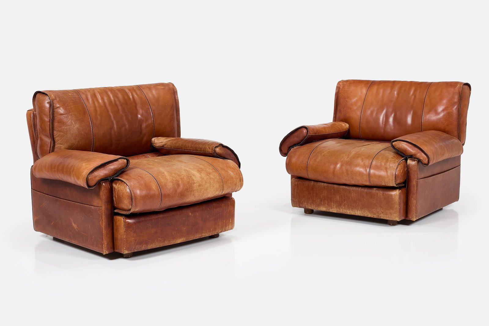 Roche Bobois, Lounge Chairs (2): ROCHE BOBOIS Pair of lounge chairs, 1970s Leather, fabric. Manufactured by Roche Bobois, France in Italy. Undersides with metal "MADE IN ITALY" tags. Each: 31.25" H x 40" W