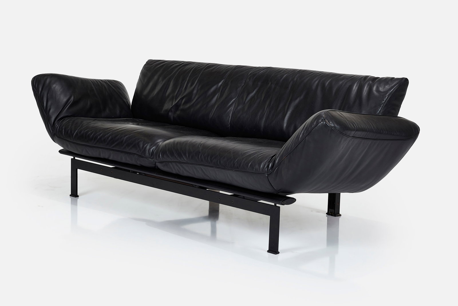 Reto Frigg, Adjustable Sofa: RETO FRIGG Adjustable sofa, model no. DS-140, 1980s Leather, painted metal, painted wood. Manufactured by de Sede, Switzerland. Side of sofa with manufacturer's logo. 35"