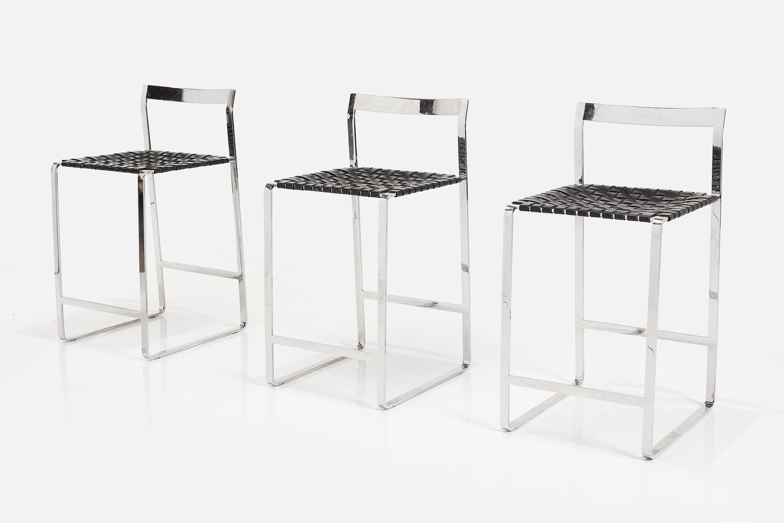 Mark Albrecht, Counter Stools (3): MARK ALBRECHT Set of three counter stools, 21st century Chrome-plated flat steel, leather. Produced by Mark Albrecht Studio, USA. Each: 33" H x 17" W x 18.25" D Seat height: