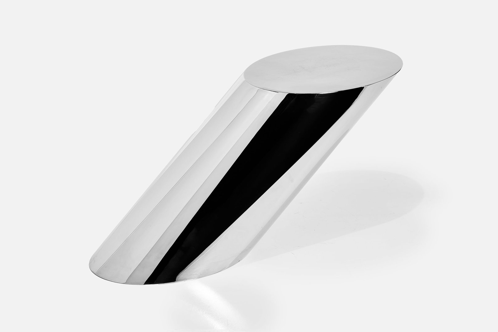 J. Wade Beam, 'Zephyr' Side Table: J. WADE BEAM 'Zephyr' cantilevered side table, 1980s Mirror-polished steel. Manufactured by Breuton International, USA. 21" H x 12" W x 42" D 