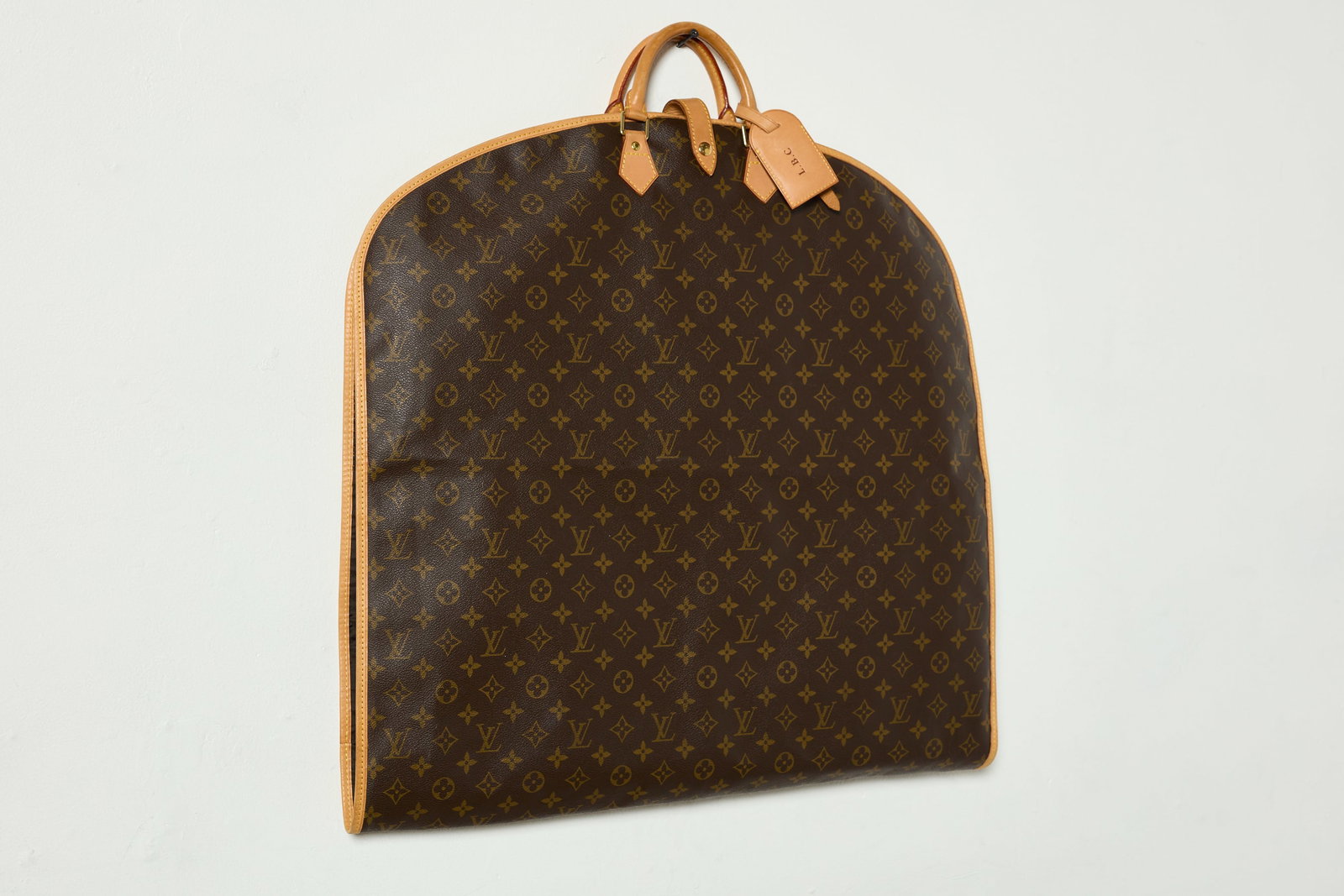 Louis Vuitton, Monogram Garment Bag: LOUIS VUITTON Monogram garment bag, 2000s Canvas, leather. Manufactured by Louis Vuitton, France. 24" H x 40" W x 2" D
