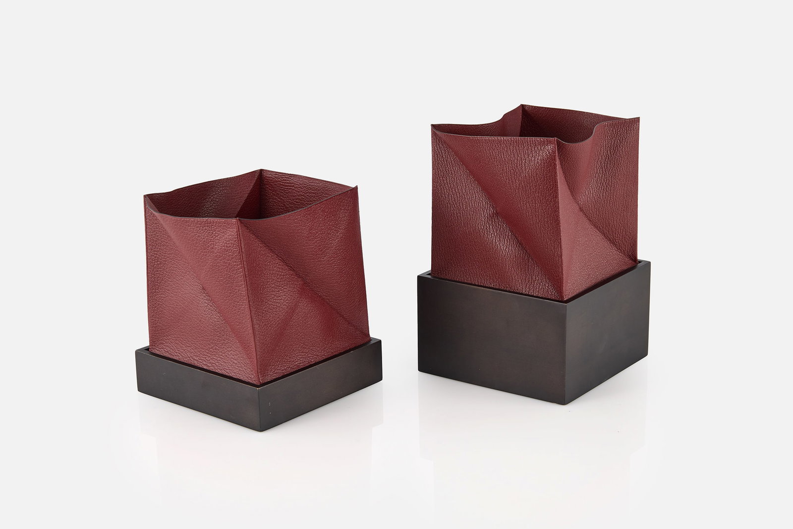 Hermes, 'Zoulou' Boxes (2): HERMES Two 'Zoulou' boxes, 2000s Leather, painted wood. Produced by Hermes, France. Various manufacturer's marks. Large: 3.5" H x 6" W x 6" D Small: