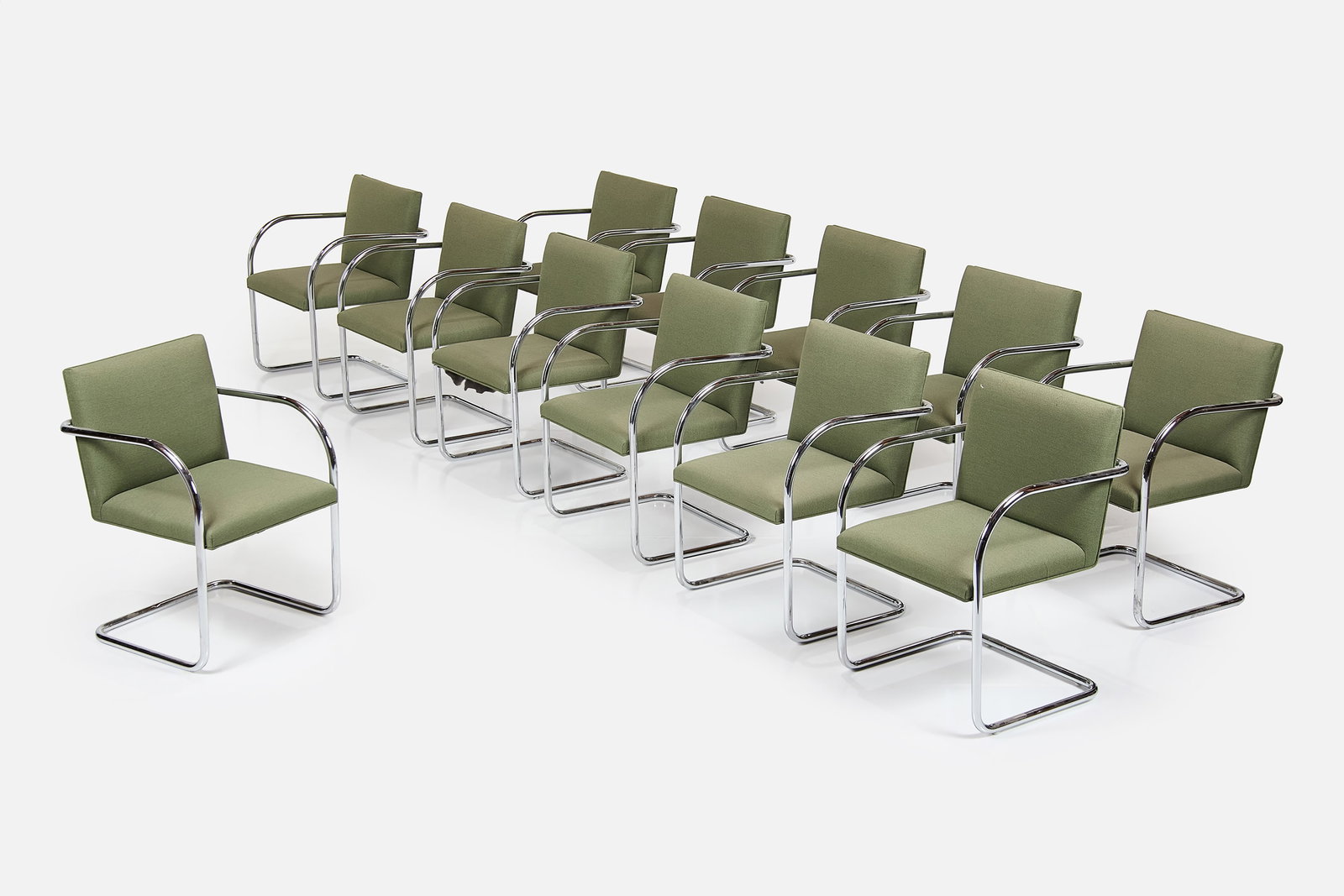 Ludwig Mies van der Rohe Style, 'Brno' Armchairs (12): LUDWIG MIES VAN DER ROHE STYLE Set of 12 'Brno' armchairs, 1980s Chrome-plated tubular steel, fabric. Each: 32" H x 21.5" W x 19.25" D Seat height: 17" Arm