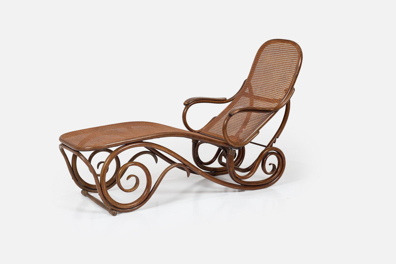 Thonet, Chaise Lounge: THONET Chaise lounge, ca. 1888 Cane, beech. Produced by Thonet, Germany. Underside branded "THONET'. 41.25" H x 25.25" W x 57.5" D