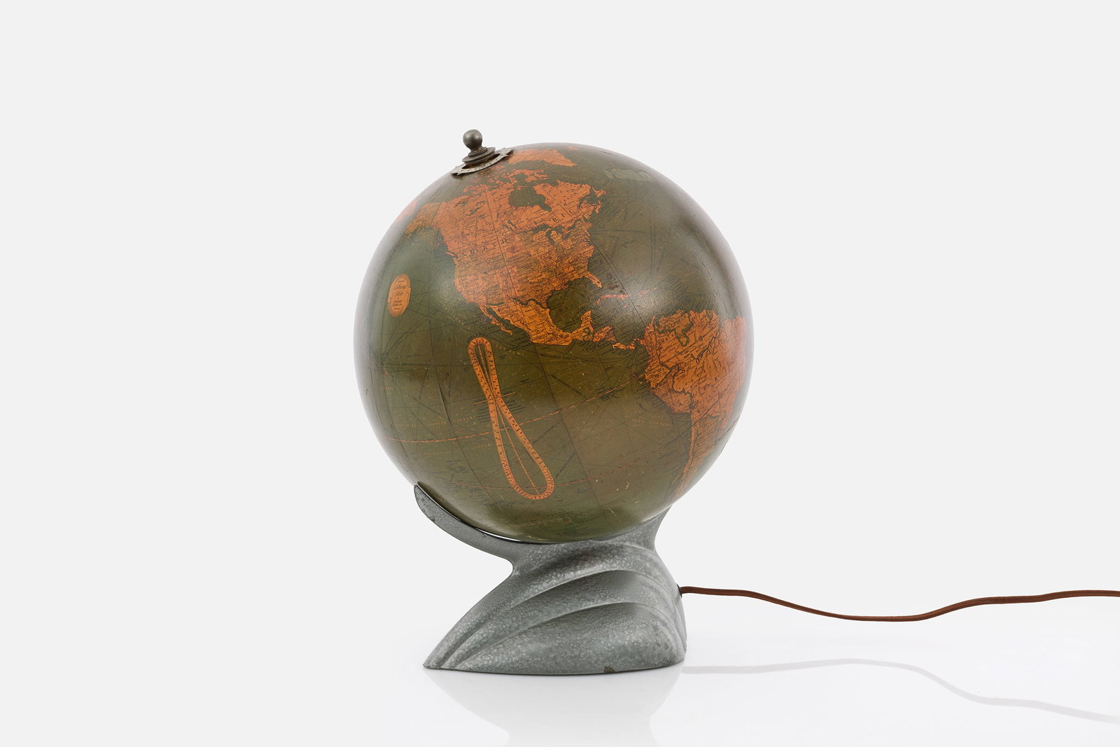 Replogle, Art Deco Illuminated Globe: REPLOGLE Illuminated globe, ca. 1936 Paper over glass, cast iron, aluminum. Produced by Replogle Globes, Chicago, IL. Globe printed with producer's information. 13" H x 10" W x 11