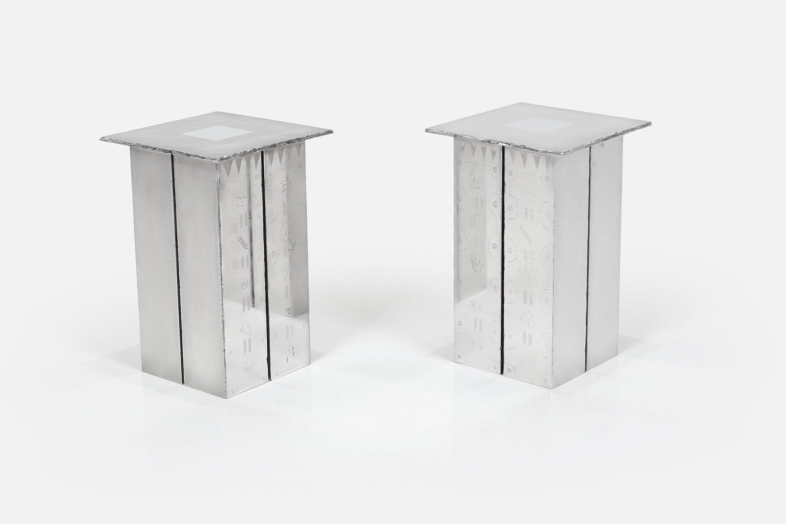 Alex Kaye, Pedestal Tables (2): ALEX KAYE Pair of pedestal tables, 2026 Hand-etched aluminum. Studio-made, Los Angeles, CA. Each: 16.5" H x 11" W x 11" D Alexander Kaye (b. 1989) is an East-LA
