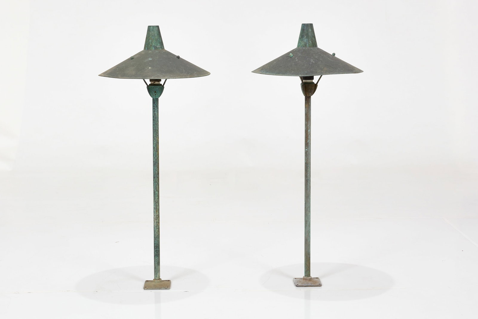 Frank Nightingale, Standing Lamps (2): FRANK NIGHTINGALE Pair of standing lamps, model no. 2308, 1950s Patinated metal. Manufactured by Kim Manufacturing, Co., USA. Base molded with "KIM MAN CO. L.A. CA". Each:
