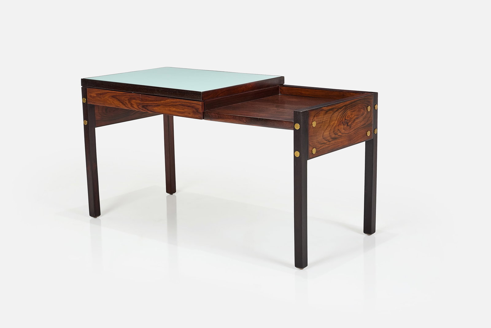 Sergio Rodrigues, 'Bloch' Desk: SERGIO RODRIGUES Desk, from the Bloch Editores S.A. Building, Rio de Janeiro, ca. 1964 Jacaranda, reverse-painted glass, brass. Manufactured by Oca, Brazil. 29.5" H x 55" W x 25.