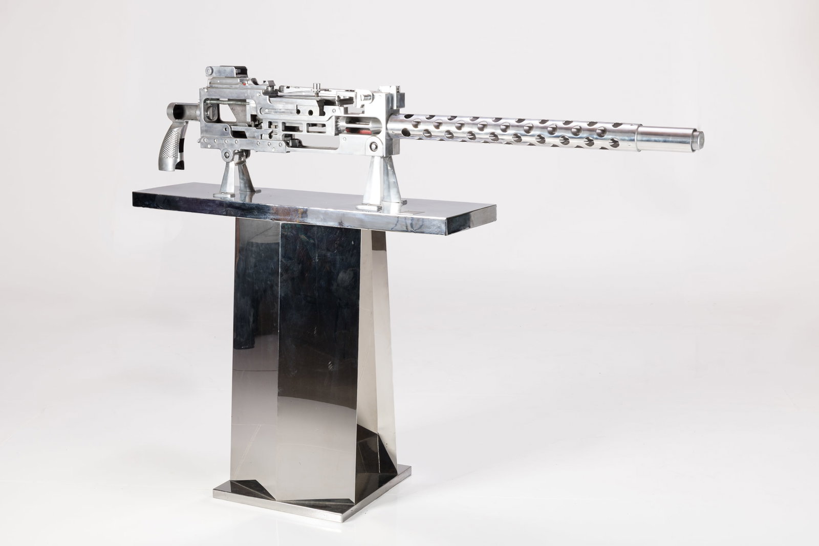 Machine Age, Machine Gun Training Model: MACHINE AGE Oversized training model 30-caliber machine gun with stand, 1940s Polished metal. Produced by Browning, USA. Base with National Guard of the United States badge which has serial