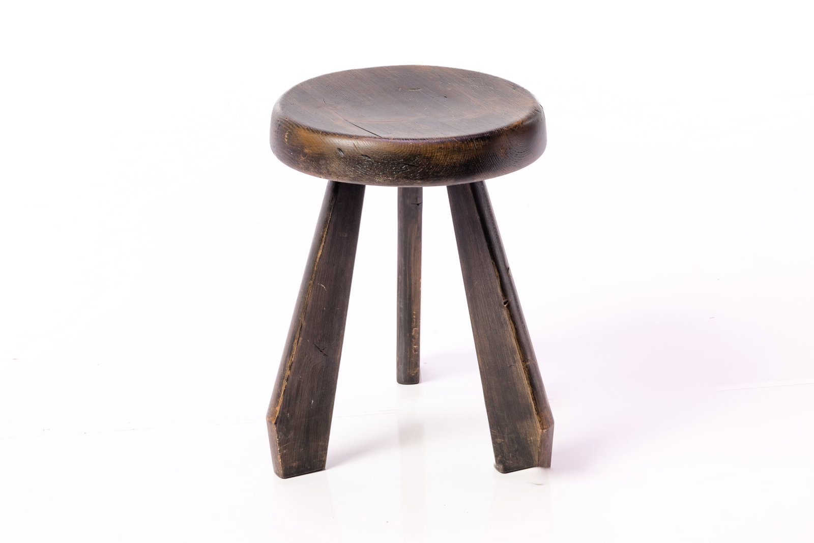 Charlotte Perriand, 'Meribel' Stool: CHARLOTTE PERRIAND 'Meribel' stool, ca. 1962 Blackened beech. Produced in France. 17.25" H x 16" Diameter