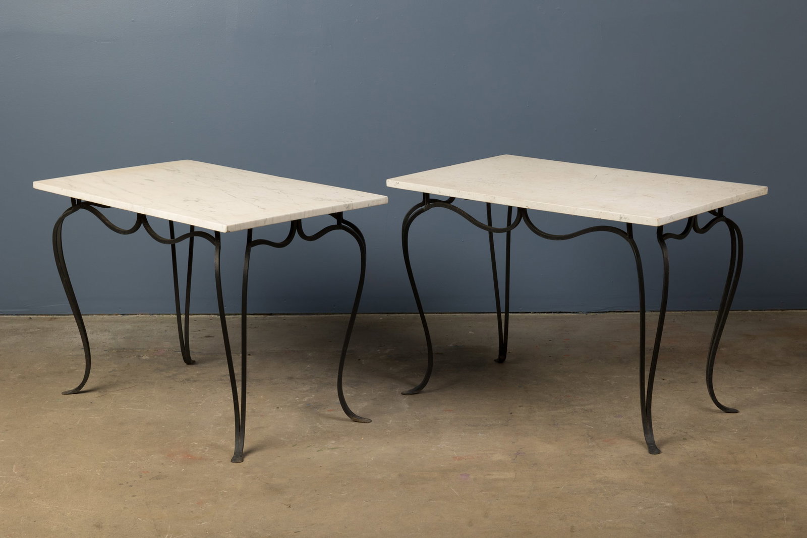 French, Marble Tables (2): FRENCH Pair of serving tables, 1950s Iron, marble. Each: 28" H x 40" W x 24" D