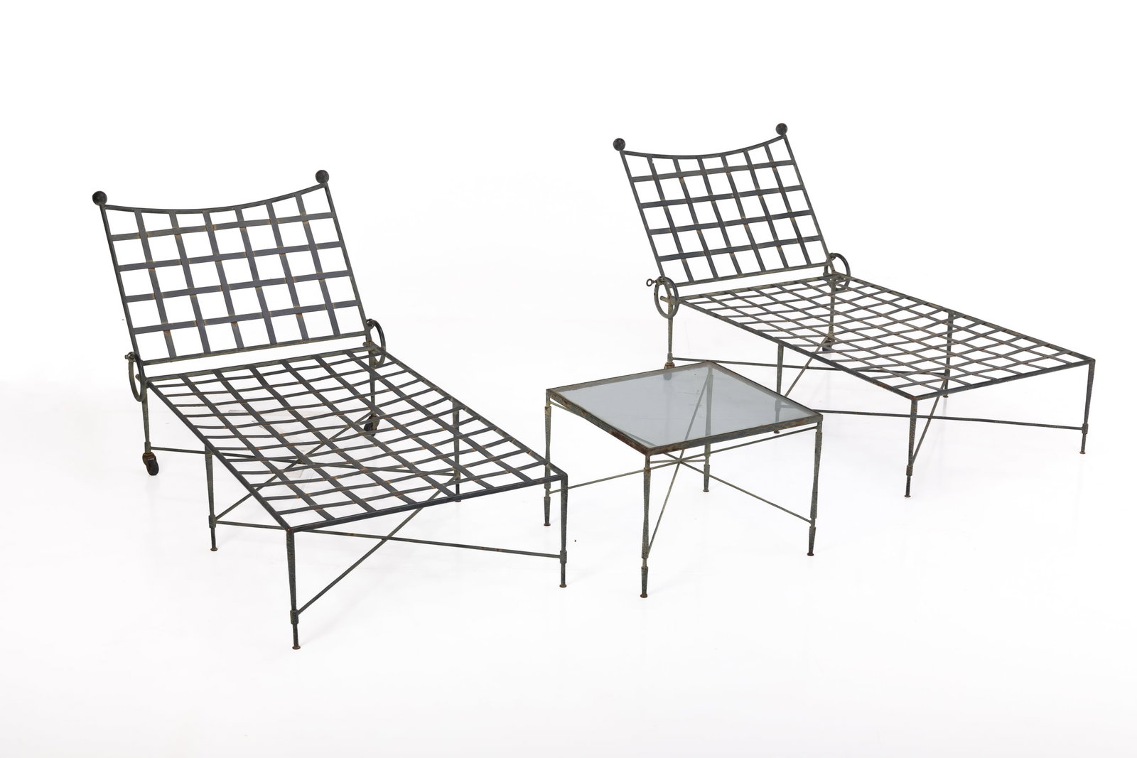 Mario Papperzini, 'Amalfi' Chaise Lounges + Table (3): MARIO PAPPERZINI Pair of 'Amalfi' chaise lounges and side table, 1950s Patinated iron. Manufactured by Salterini, Italy / USA. Each chaise: 16" H x 32" W x