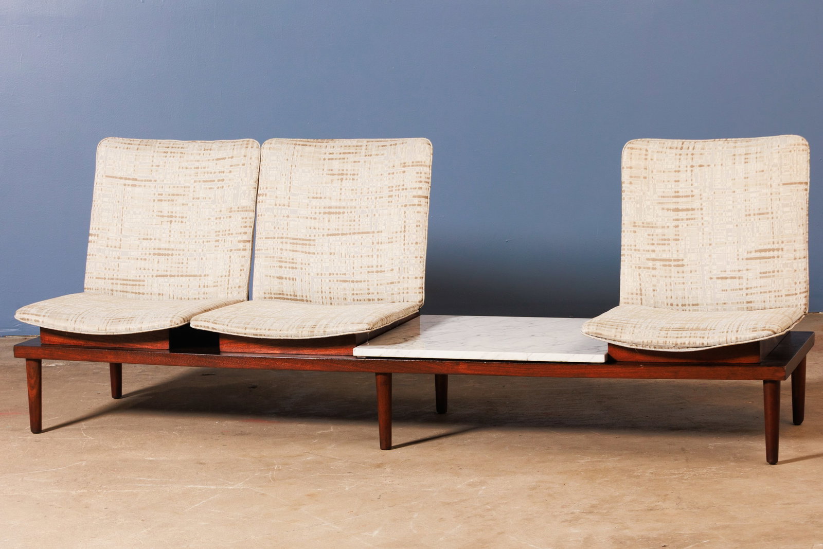 Pedro Ramirez Vazquez, Architectural Sofa: PEDRO RAMIREZ VAZQUEZ Architectural sofa, 1950s Stained wood, fabric, marble. Manufactured by Industrias Ruiz Galindo SA (IRGSA), Mexico. Underside with manufacturer's label. 