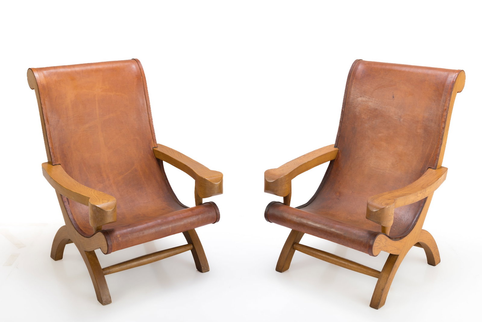 Clara Porset, 'Butaque' Chairs (2): CLARA PORSET Pair of Butaque chairs, 1940s Cypress, leather. Made in Mexico. Underside of seat marked "MADE IN MEXICO". Each: 41.5" H x 28.5" W x 33" D Seat height:
