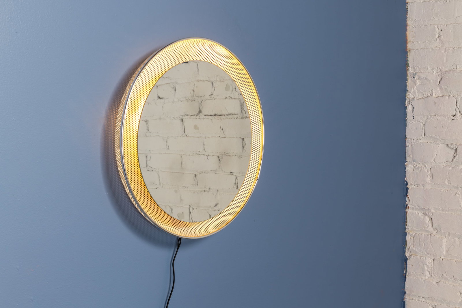 Custom, Illuminated Mirror: CUSTOM Illuminated mirror, 2020s Painted perforated metal, chromed metal, mirrored glass. Custom-made in Los Angeles, CA. 25" Diameter x 3" D