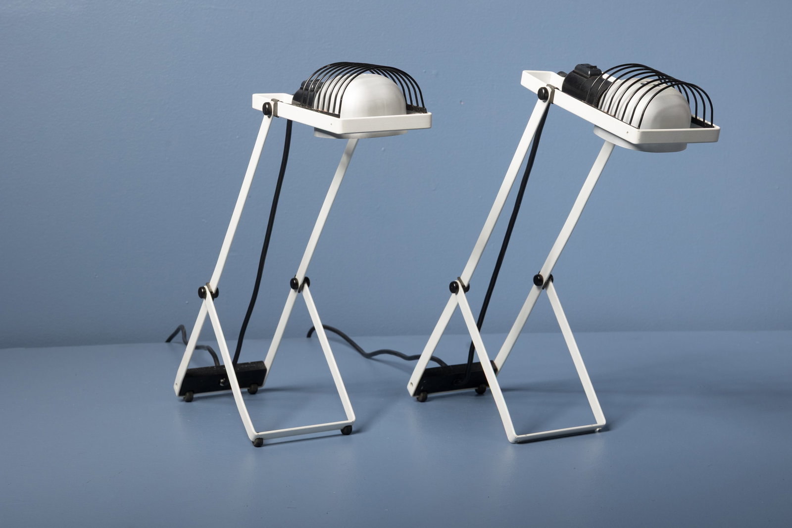 Ernesto Gismondi, 'Sintesi' Lamps (2): ENESTO GISMONDI Pair of 'Sintesi' table lamps, 1980s Painted metal, aluminum, plastic, rubber. Manufactured by Artemide, Italy. Underside molded with manufacturer's information. 