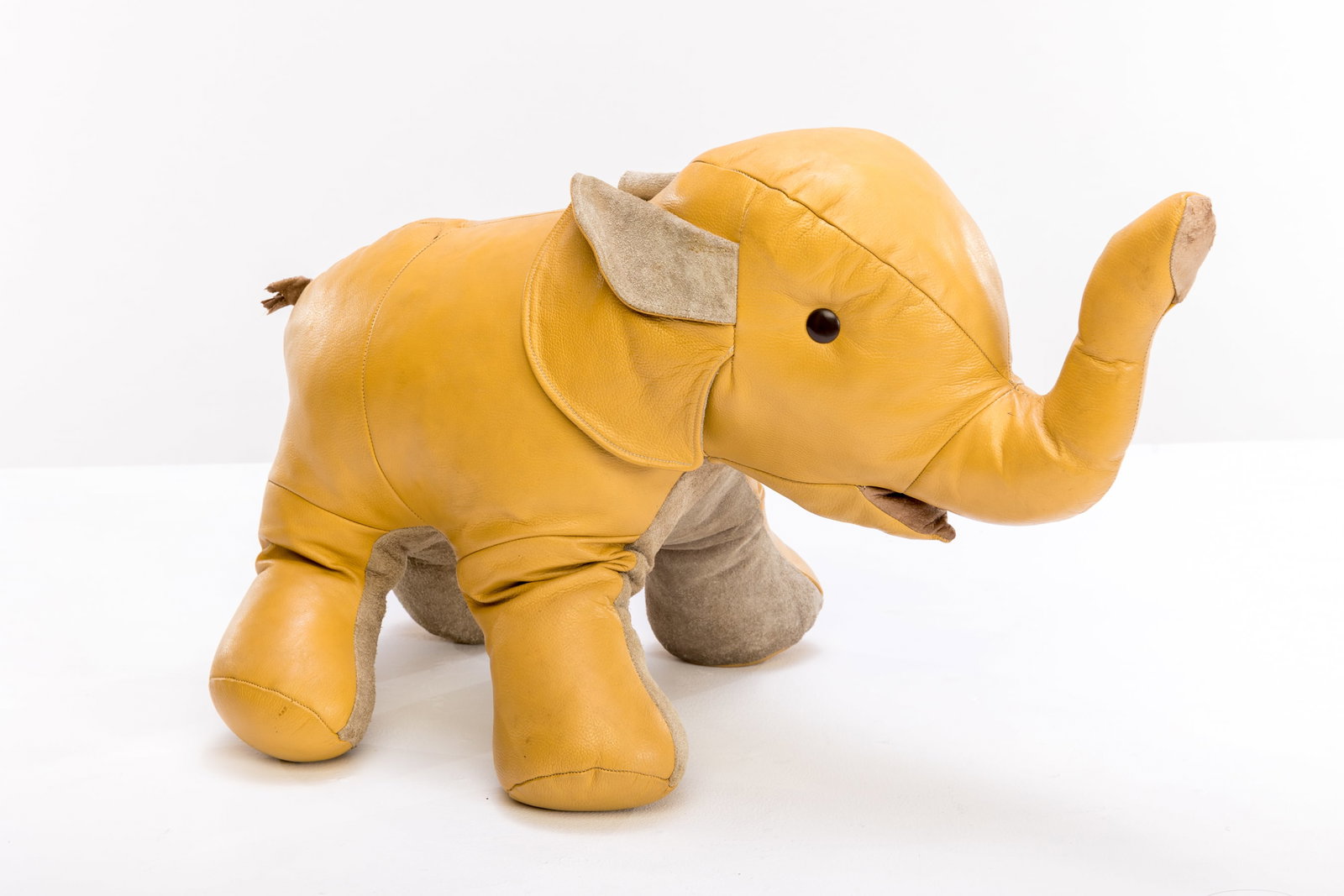 Italian, Elephant Footstool: ITALIAN Elephant footstool, 1970s Leather, fabric. 17" H x 26" W x 12" D