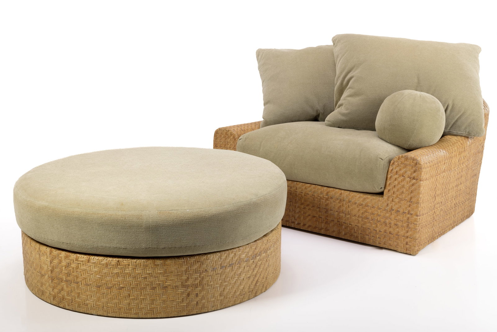 Michael Taylor, 'Jennifer' Lounge Chair + Ottoman (2): MICHAEL TAYLOR 'Jennifer' chair and ottoman, 1970s Hand-woven herringbone rattan, fabric. Produced by Michael Taylor, USA. Chair: 28" H x 53" W x 43" D Seat height: