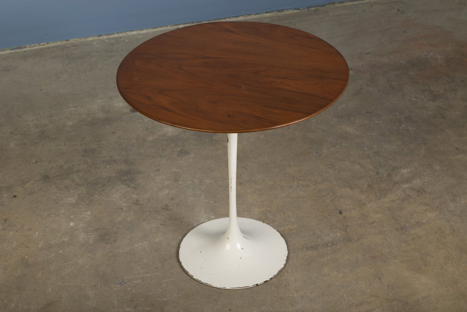 Eero Saarinen, 'Tulip' Side Table: EERO SAARINEN 'Tulip' side table, 1960s Walnut, painted steel. Manufactured by Knoll Associates, USA. Underside with manufacturer's label. 20.5" H x 20" Diameter