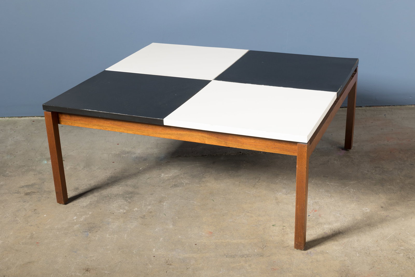 Lewis Butler, Coffee Table: LEWIS BUTLER Coffee table, 1950s Walnut, laminate. Manufactured by Knoll Associates, USA. Underside with manufacturer's paper label, 16" H x 38.5" W x 34" D