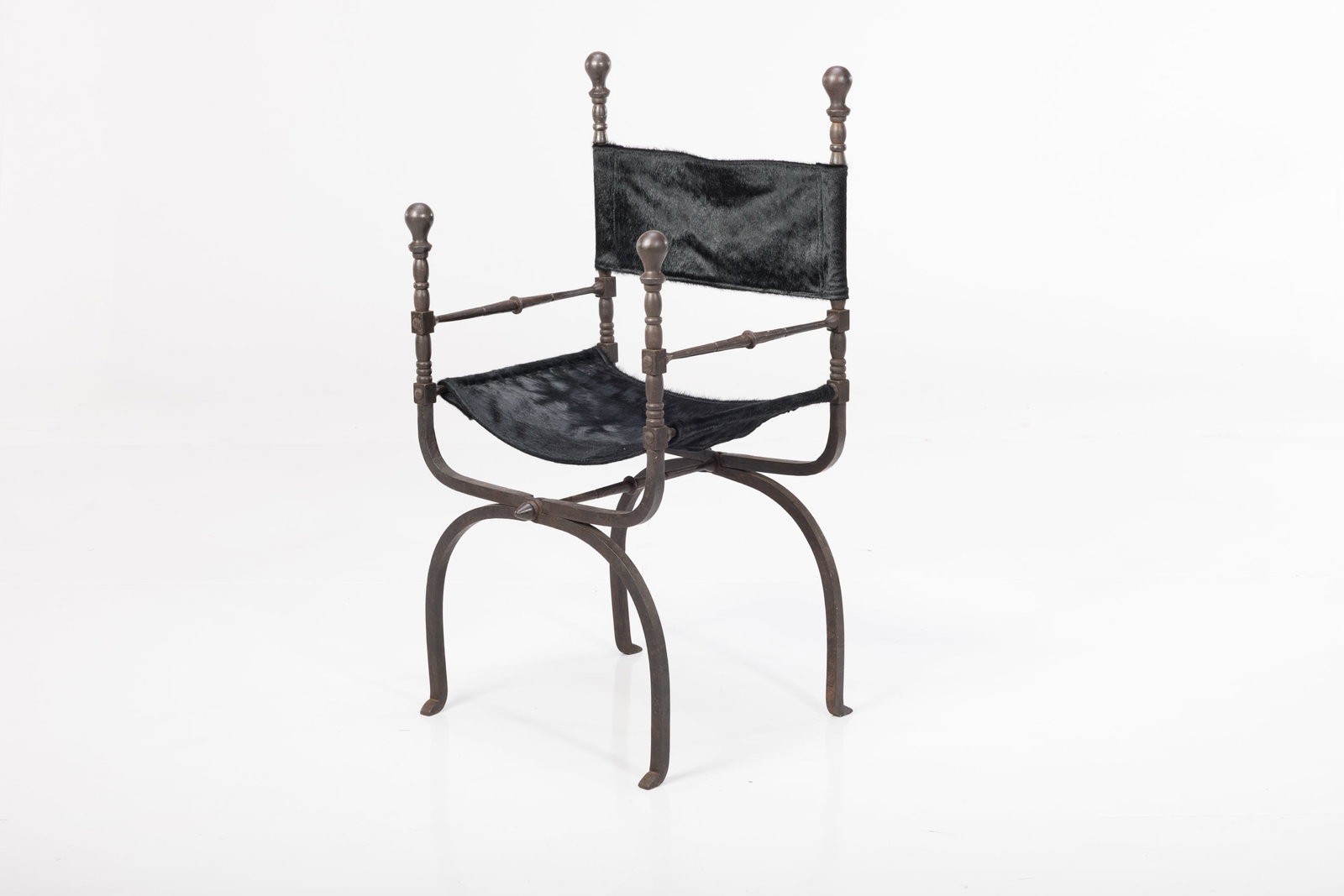 Italian, Savonarola Chair: ITALIAN Savonarola chair, mid-20th century Iron, hide. 39.5" H x 21" W x 19" D Seat height: 17"