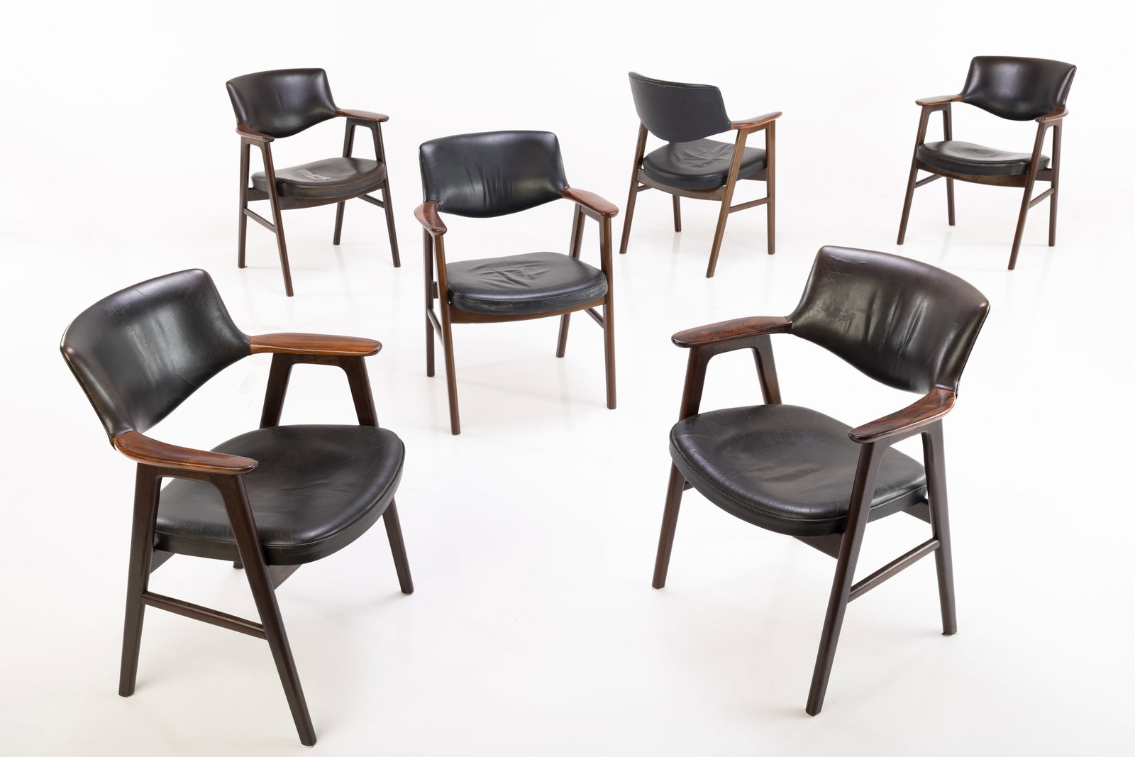 Erik Kirkegaard, Rosewood Armchairs (6): ERIK KIRKEGAARD Set of six armchairs, model no. 42, 1960s Rosewood, stained wood, leather. Manufactured by Hong Stolefabrik, Denmark. Underside branded "MADE IN DENMARK DESIGNED BY ERIK