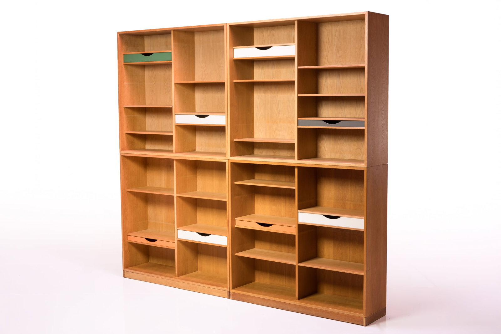 Borge Mogensen, Stacking Bookcases (4): BORGE MOGENSEN Set of four stacking bookshelves, 1960s Oak, lacquered wood. Manufactured by Karl Andersson, Sweden. Three examples with manufacturer's decal. Each: 47" H x 53" W
