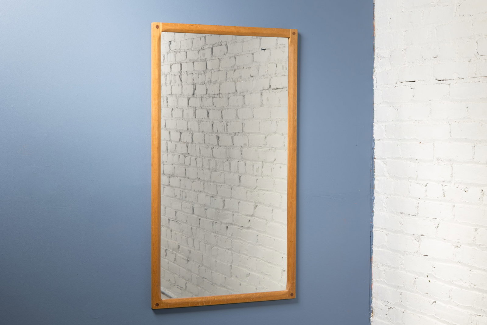 Aksel Kjersgaard, Wall Mirror: AKSEL KJERSGAARD Wall mirror, 1960s Oak, teak. Produced by Aksel Kjersgaard Odder, Denmark. Back stamped with producer's information. 41.5" H x 23" W x 1" D