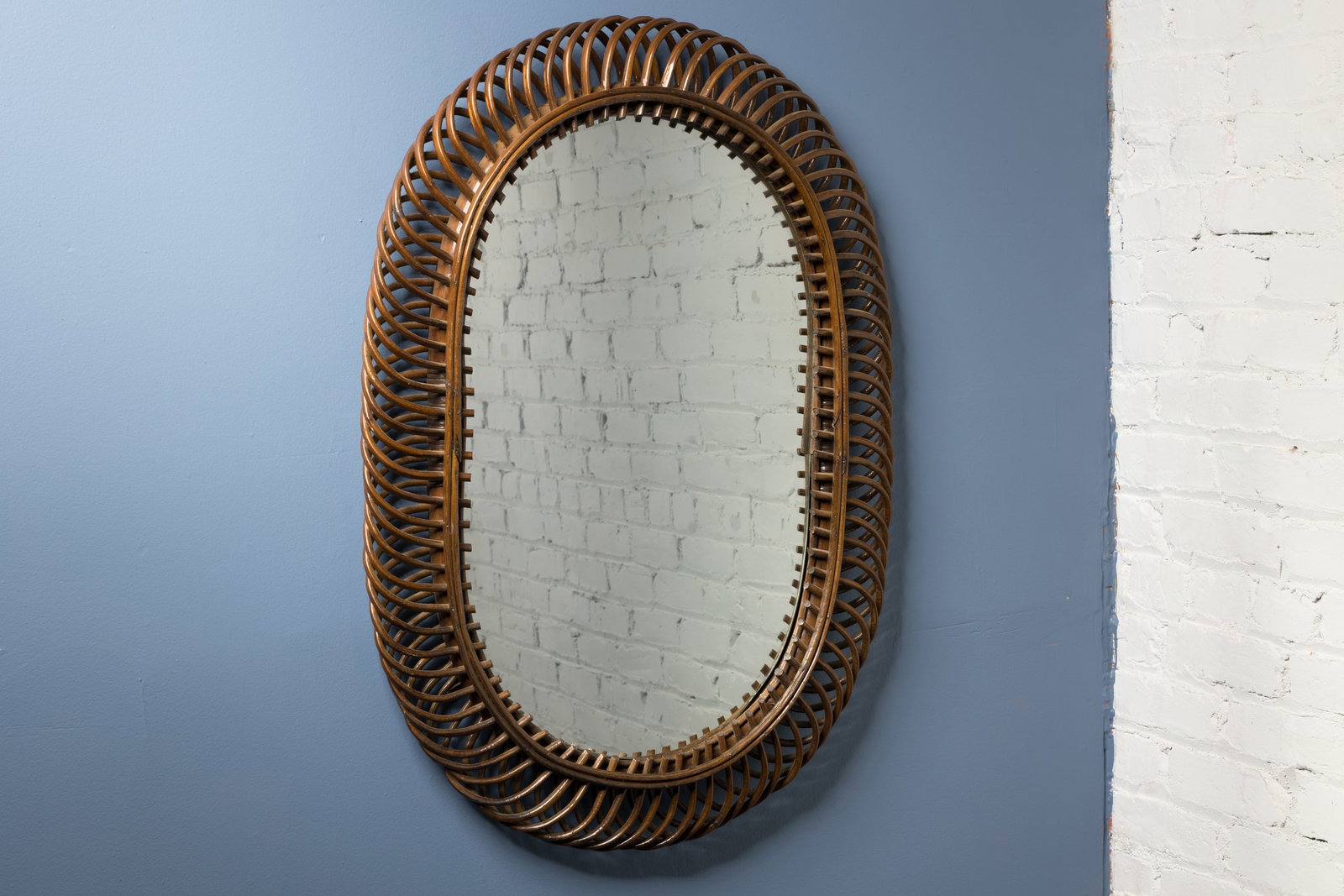 Danish, Rattan Mirror: DANISH Wall mirror, 1970s Stained rattan, mirrored glass. 36" H x 24" W x 2.5" D