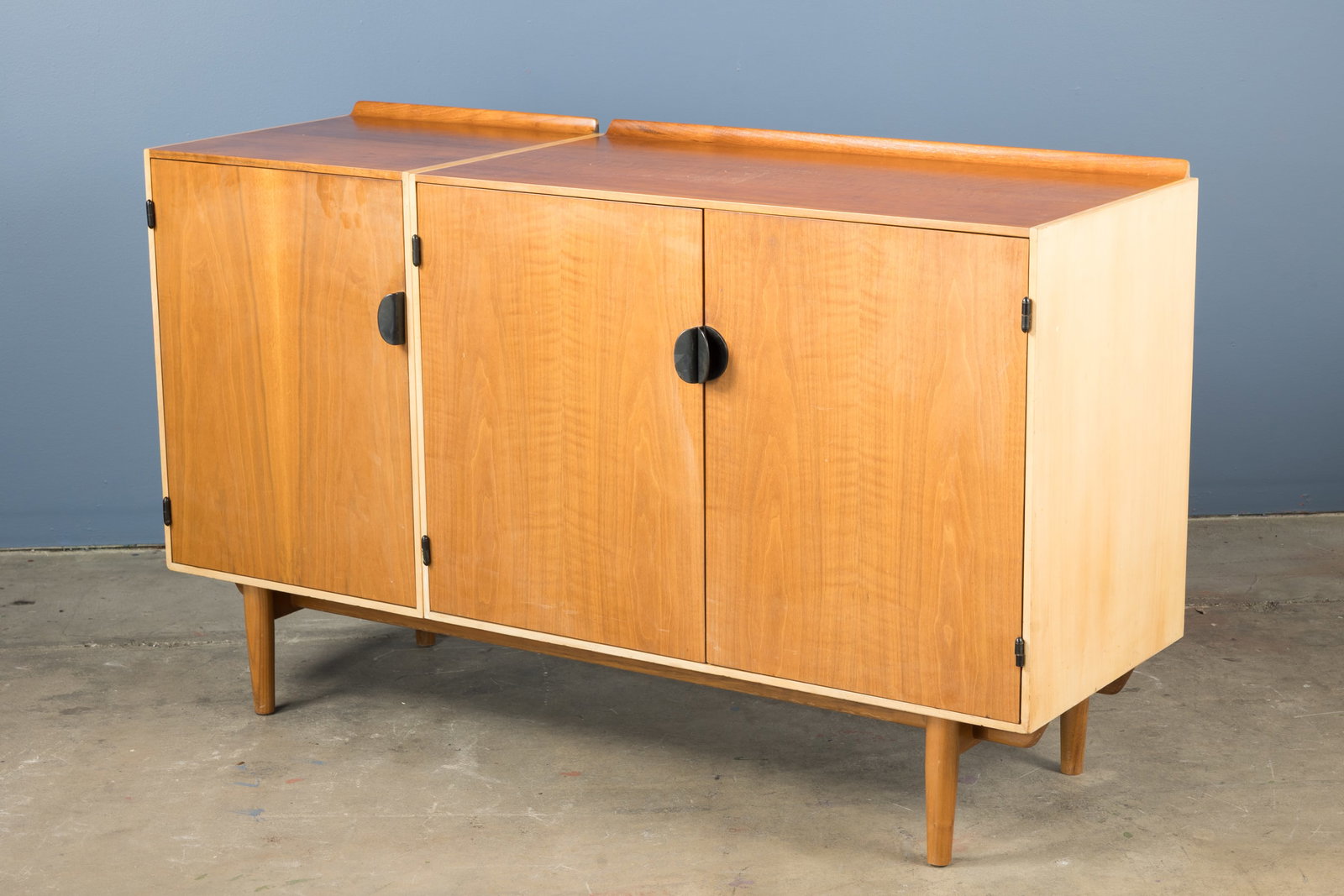 Finn Juhl, Cabinet: FINN JUHL Cabinet, 1950s Teak, maple. Produced by Baker, USA. Manufacturer's label in drawer. 32" H x 54.5" W x 18" D