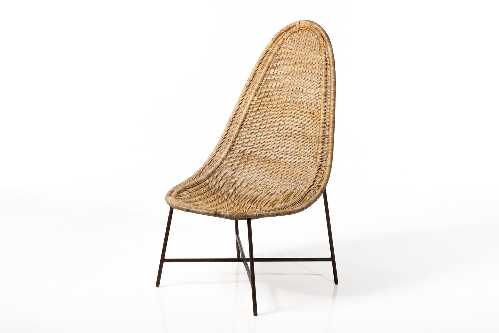Kerstin HoÌˆrlin-Holmquist Style, Lounge Chair: KERSTIN HORLIN-HOLMQUIST STYLE Lounge chair, 1950s Painted iron, rattan. Produced in Denmark. 44.5" H x 26.5" W x 21" D Seat Height: 16"