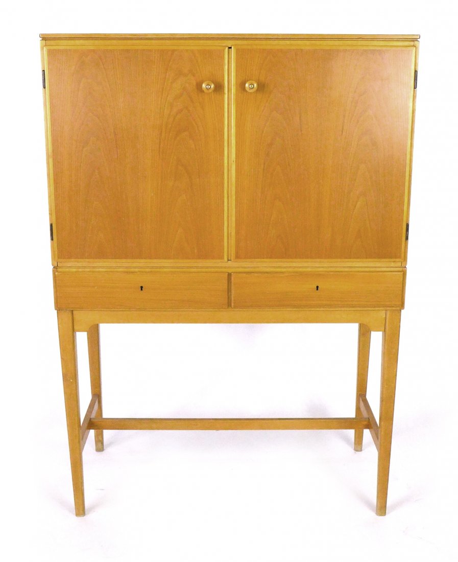 Carl Axel Acking Swedish cabinet: Birch and teak cabinet designed by Carl Axel Acking for AB Nordiska, Stockholm. 37" W x 18" D x 54" T