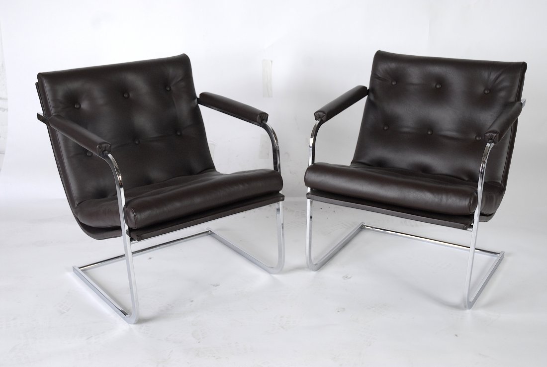 Lounge chairs in the manner of Milo Baughman: Pair of chrome and leather lounge chairs. Heavy and well made in the manner of Milo Baughman. 25" W x 28" D x 29" T