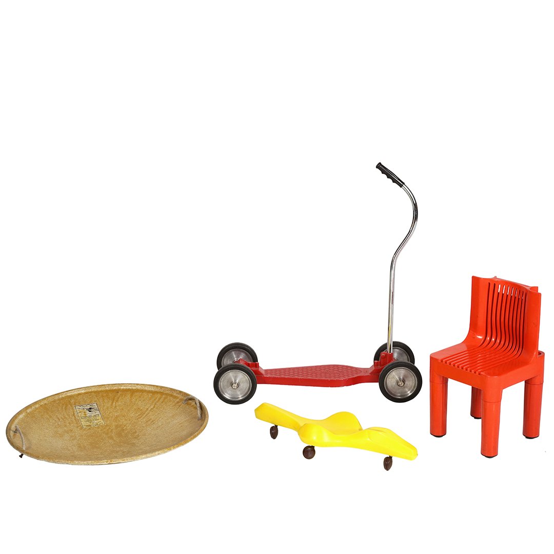 Vintage children's toys (4): Lot of four vintage children's toys, including: Creative Playthings Crawligator, Marco Zanuso stacking chair, SuperJet fiberglass sled, and a Temco Jet scooter, circa 1960.