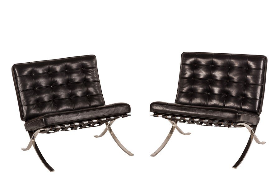 Ludwig Mies Van der Rohe Barcelona chairs (2): Black leather and stainless steel Barcelona chairs by Ludwig Mies Van der Rohe for Knoll, 1970s. 29" H x 29.92" W x 29.92" D.