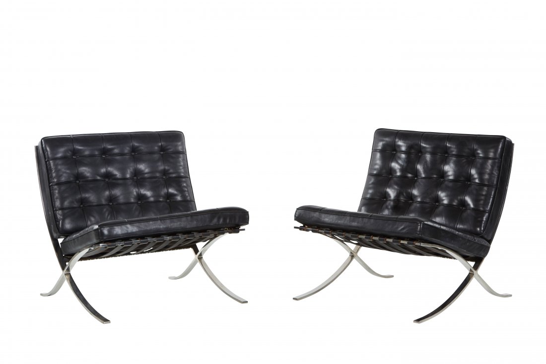 Ludwig Mies Van der Rohe Barcelona chairs (2): Black leather and stainless steel Barcelona chairs by Ludwig Mies Van der Rohe for Knoll, 1970s. 29" H x 29.92" W x 29.92" D.