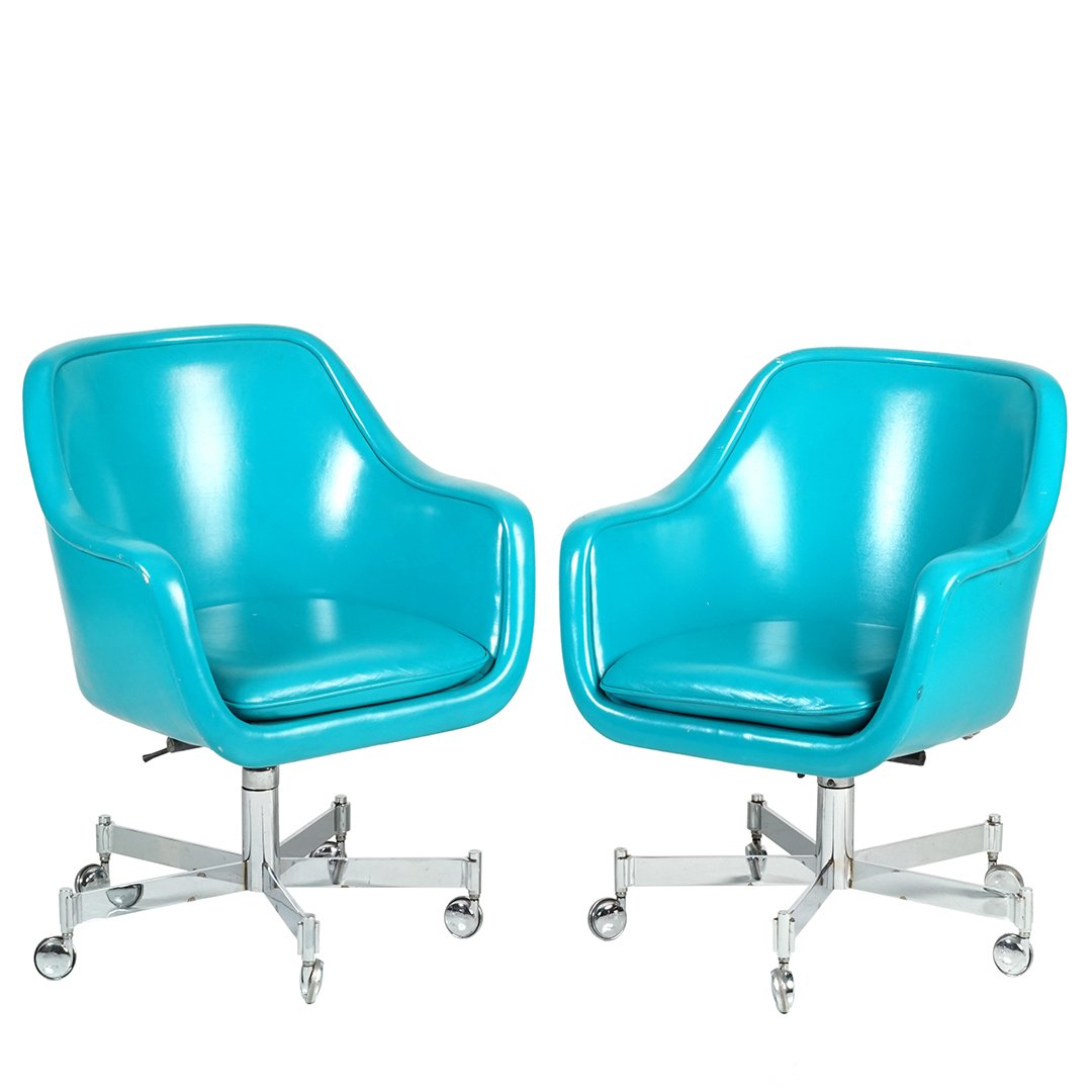 Ward Bennett chairs: Pair of swivel chairs in teal leather on a pivoting chrome base by Ward Bennett for Brickel, 1970s. 34" T x 27" D x 27" W.