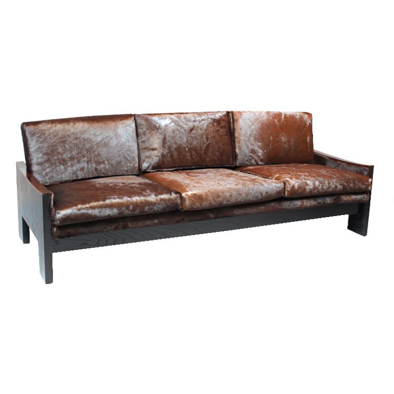 Rosewood and ebonized oak sofa: Ebonized oak and rosewood sofa upholstered in brown hide, Brazil 1960s. 30.5" H x 8.5' W x 31" D.