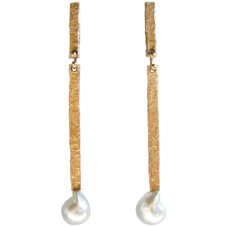 Ed Wiener 14k gold and mabe pearl earrings: 14k gold and grey mabe_ pearl earrings by Ed Wiener, 1960s. Earrings measure 3" in length.